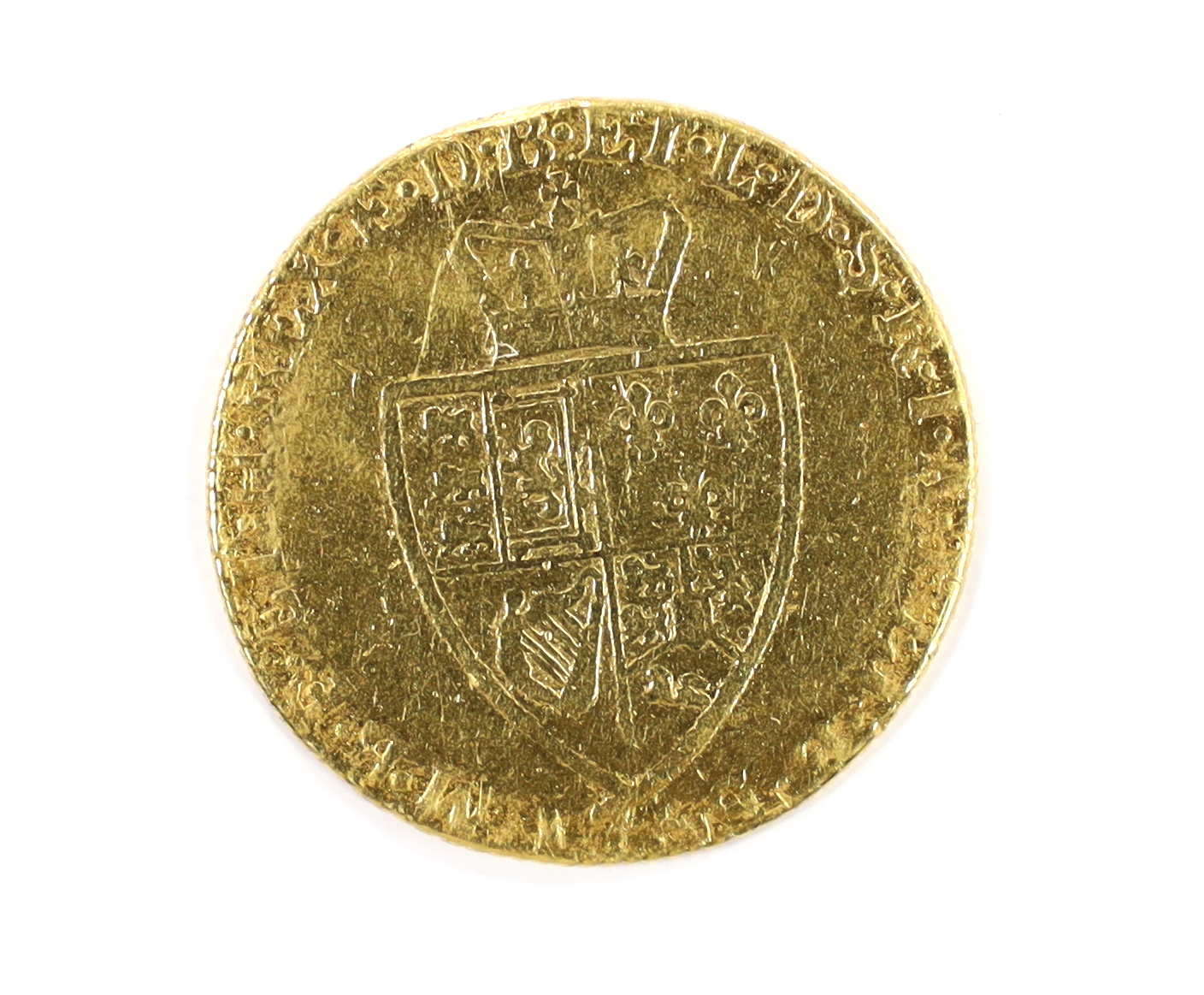 British gold coins, George III gold spade guinea 17?9, demounted and pitted otherwise near VF